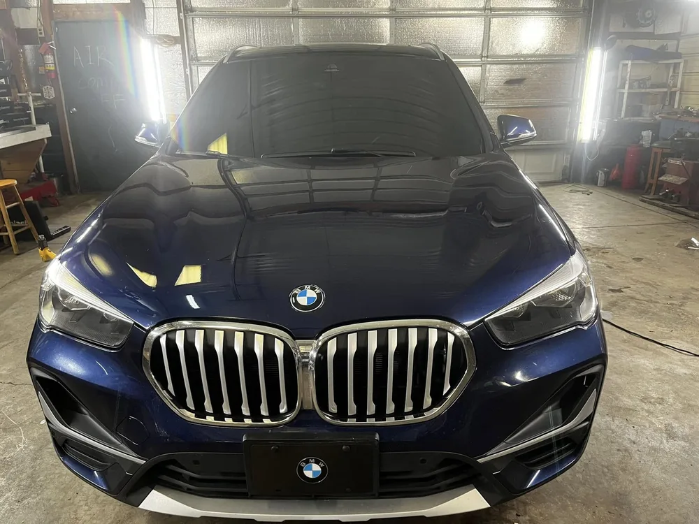 Black BMW X5 with freshly installed window tint