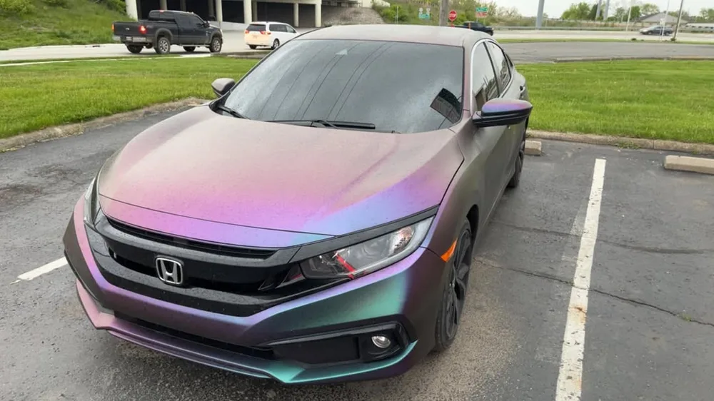 Vehicle with color-shifting chameleon window tint film